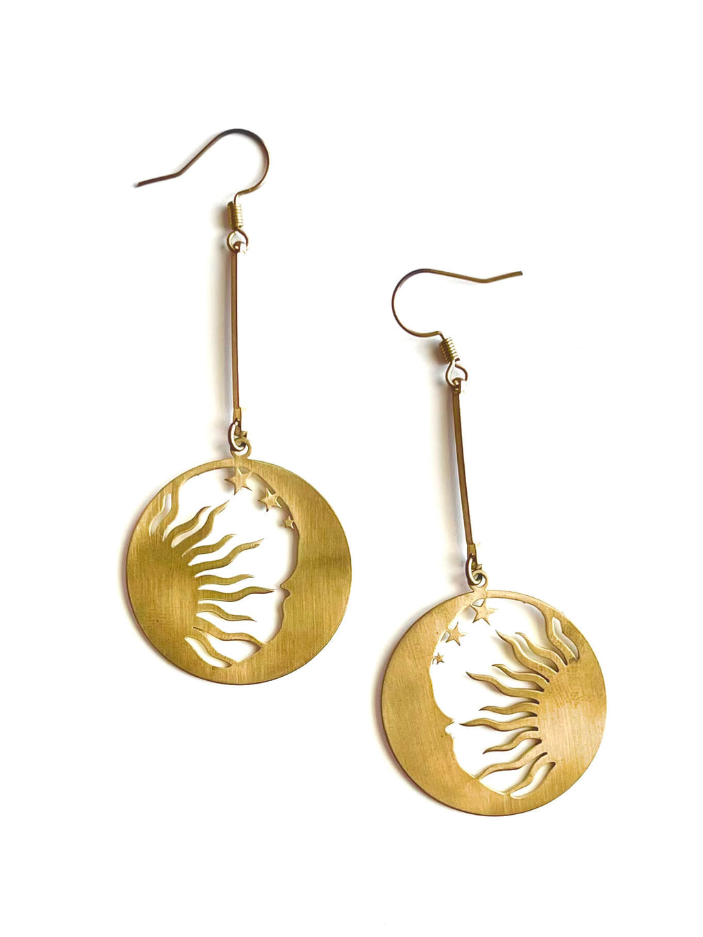 Yellow brass sun and moon pendant earrings on a white background