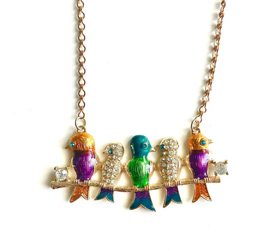 Colorful bird-shaped necklace on a white background